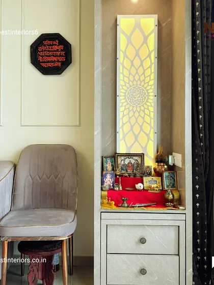 For smaller spaces, a compact pooja unit like this is a great solution. It features a backlit jaali panel and drawers for storage, creating a dedicated spiritual corner without taking up much room.
