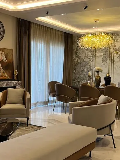 An example of a grand living and dining area where our automation systems work in the background. The focus is on the luxurious decor, while technology provides effortless control over lighting and ambiance.