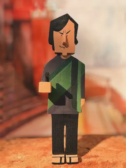 This is my wooden interpretation of Feluda, the central character of the 'Joy Baba Felunath' series. The sharp, geometric carving style gives this collectible a distinct and modern artistic feel.
