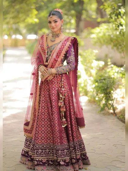 A full-length shot of the silk lehenga, showcasing the beautiful latkans and the flow of the skirt. It’s a celebration of color and craftsmanship.