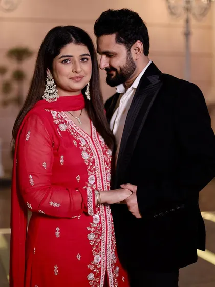 Here is a beautiful, candid moment from a couple's shoot. Her makeup is soft and romantic, with an emphasis on radiant skin and defined eyes that sparkle. This look was designed to be timeless and elegant, perfect for engagement photos or anniversary celebrations.