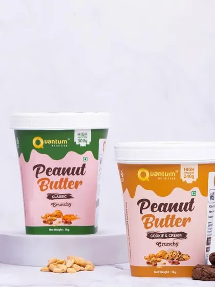 A group shot of the entire range of Quantum Nutrition's peanut butter flavors. This clean, organized presentation against a marble background is ideal for website banners and product line showcases.