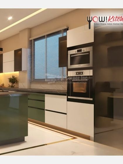 Sophistication and elegance are at the core of our designs. This kitchen features a striking olive green island, white high-gloss cabinets, and a tall unit housing the microwave and oven.