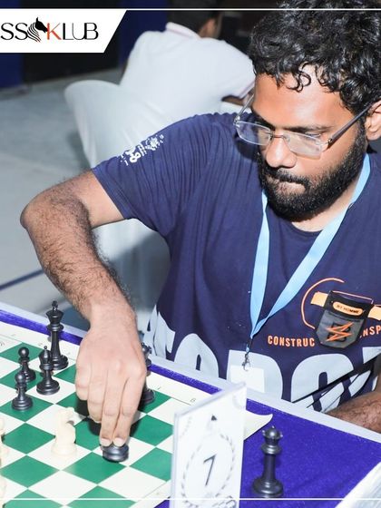 A player makes a critical move in a high stakes game. Our tournaments feature players from various chess clubs, creating a challenging and dynamic competitive field.
