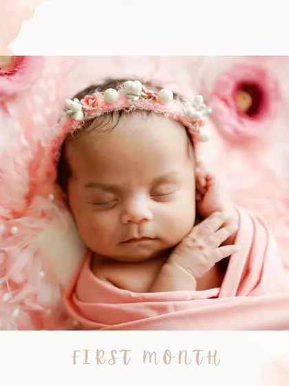 A close-up portrait capturing the delicate features of a newborn in her first month. The soft pink swaddle and floral headband complement her peaceful expression perfectly.
