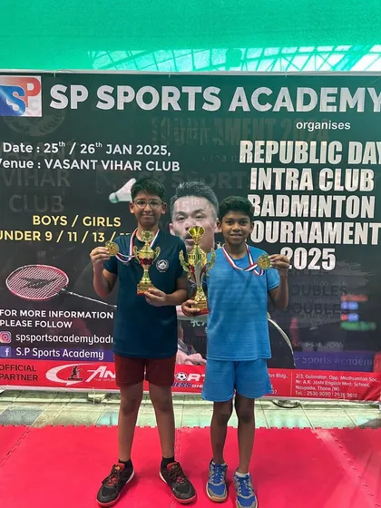 Young boys' finalists proudly displaying their medals and trophies.