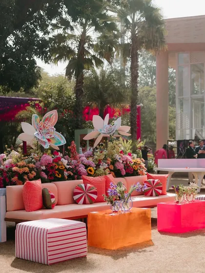 More from our carnival-themed Mehendi, with brightly colored furniture and oversized paper flowers. The decor was designed to be bold, energetic, and a feast for the eyes.
