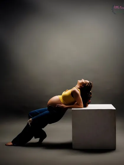 An artistic pose using a simple white block, creating strong lines and a modern feel.