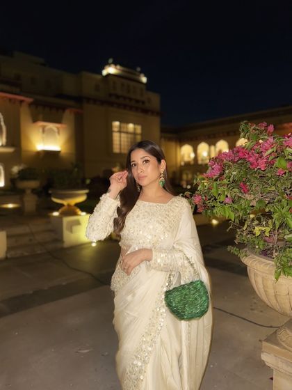 The beauty of a classic white saree is its versatility. The intricate sequin work on this piece adds just the right amount of sparkle, making it perfect for a sangeet or reception.