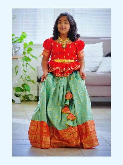 My client looks lovely in this turquoise Pattu lehenga paired with a contrasting red maggam work blouse. It's always a pleasure to send my creations all the way to the USA.