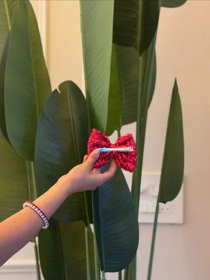 The back of our sparkly bow, showing the clip attachment. It's secure and easy to use.