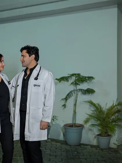 A fun concept for a doctor couple! Their love story, captured in their professional coats, shows that romance can be found anywhere, even after a long day of saving lives.