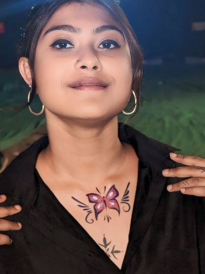 A bold butterfly design painted on the chest, a beautiful centerpiece.