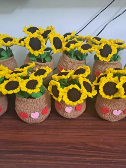 A whole family of sunflower pots lined up! I often make these in bulk for events or as corporate gifts, as they are sure to bring a smile to anyone's face.