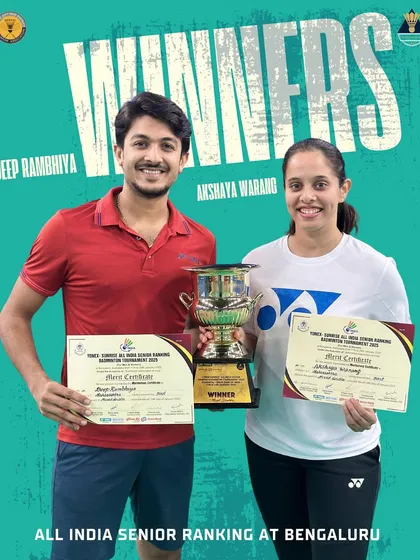 Deep Rambhiya and Akshaya Warang holding their winners' trophy at the All India Senior Ranking Tournament in Bengaluru. Their consistent victories solidify their position as a top national pair.