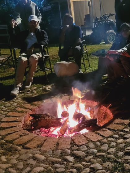 Sharing stories and warmth around a campfire at the Ultimate Survival Camp. This is where friendships are made after a long day on the trails.