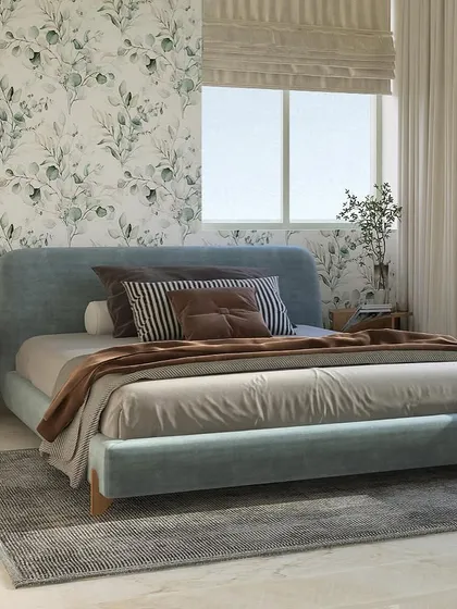 Natural light floods this minimalist bedroom, highlighting the clean lines of the furniture and the gentle patterns of the wallpaper. It's a perfect example of how we balance aesthetics with a sense of tranquility.