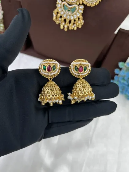 A close-up of the jhumki earrings from the Tishyaa set.