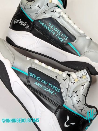 A close-up of the hand-painted text on the Hamilton customs. "Lewis, it's hammer time" and "Still we rise" are phrases every F1 fan knows.