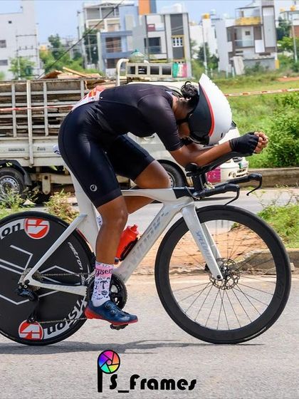 An action shot of one of our women racers in full aerodynamic tuck during a State Championship Individual Time Trial (ITT). This photo showcases the focus and power required for competitive racing.