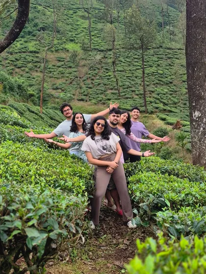 A group of friends posing in a tea estate during the Bandaje trek. The journey is as beautiful as the destination.