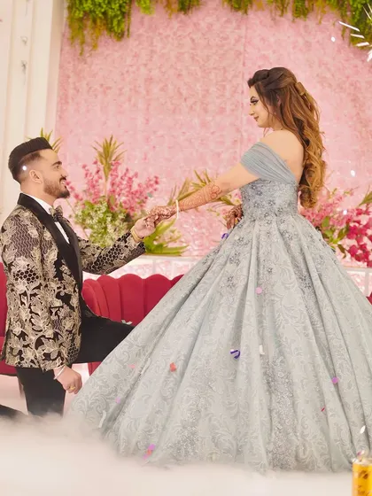 A magical moment captured as the groom proposes to his bride, who is wearing my ethereal light blue ball gown. The voluminous skirt creates a beautiful silhouette, perfect for romantic photos.