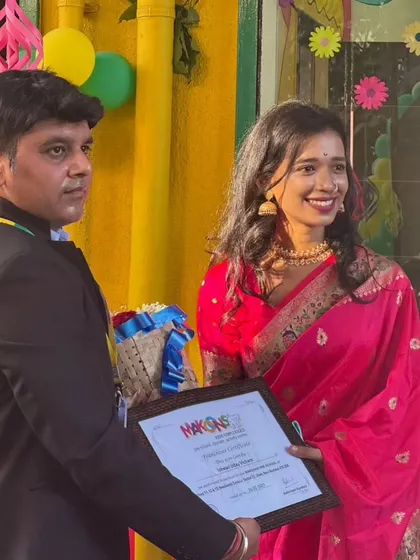 Receiving a certificate of partnership on our opening day. This moment represents the culmination of hard work and the beginning of my entrepreneurial journey in early childhood education.