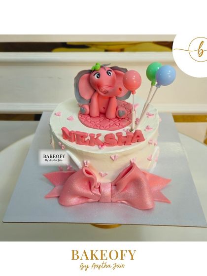 A sweet and adorable elephant cake for a special day. This 900gm fresh fruit cake is topped with a cute pink fondant elephant and a big bow.