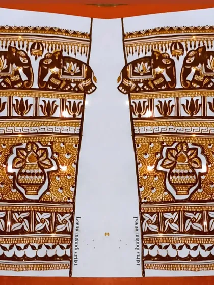 A full-arm practice design featuring elephants and a central kalash motif.