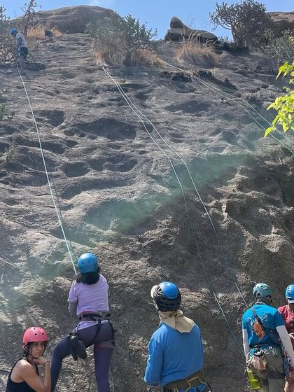 A view from above as new climbers learn the basics on the slab wall. Our workshops provide a safe and controlled environment for everyone to get comfortable on the rock.