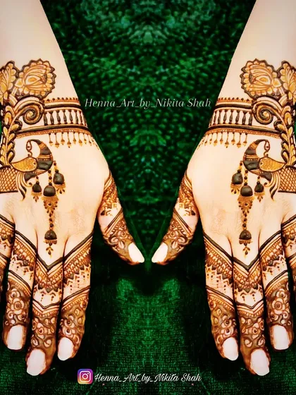A chic and stylish back-hand design. The peacock motif is designed in a modern, flowing style that is very popular.