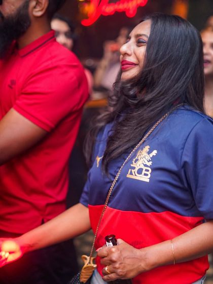 Even sports fans come to party, like this guest in an RCB jersey.