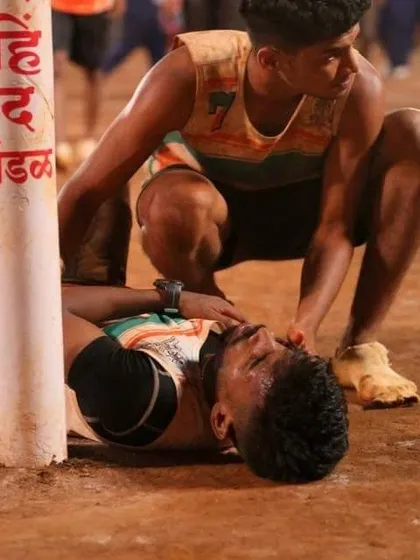 A moment of sportsmanship and concern between players.
