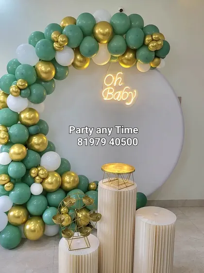 A modern and stylish baby shower decoration using sage green, white, and gold balloons. This color palette is perfect for a gender-neutral celebration.