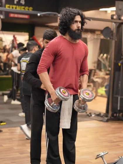 Getting ready for a set of bicep curls. Focus and intensity are key during every workout.
