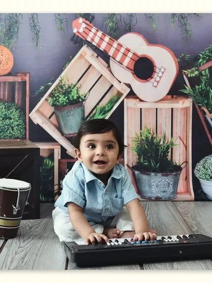 A future musician in the making. This little boy is having a wonderful time playing the keyboard in our music-themed studio.