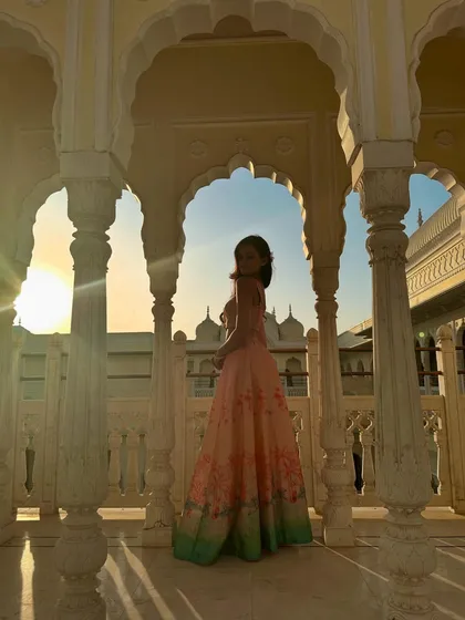 A photoshoot in a beautiful palace-like setting. The right location and outfit can make you feel like royalty, which is the vibe I aim for in my sangeet choreography.