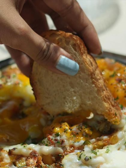 The best way to enjoy my shakshouka is to dip a piece of crusty bread right into the runny yolk and spiced tomato sauce. It’s a truly comforting experience.
