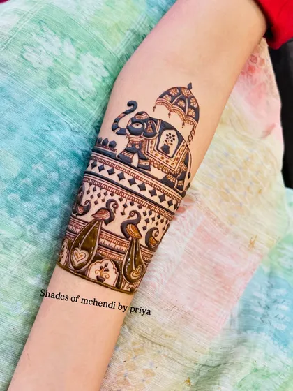 A close-up of a royal elephant motif, a symbol of prosperity and a beautiful element in bridal mehendi. The intricate details on the elephant's saddle are all done by hand.