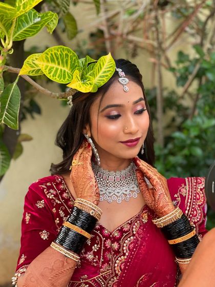 A candid moment during Pallavi's reception photoshoot. The makeup is designed to look flawless from every angle, even in natural outdoor lighting.
