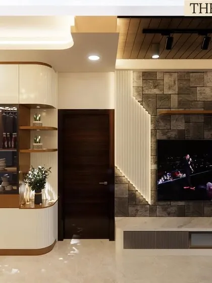 This view highlights our skill in executing multi-material designs. We managed the installation of the stone-clad TV unit, the wooden slat ceiling panel, and the curved, veneer-finished crockery cabinet, ensuring each element flows into the next as per the original architectural plan.