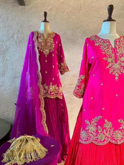 The fine gold embroidery on these pink and purple sharara sets catches the light beautifully, making them a perfect choice for evening festivities.