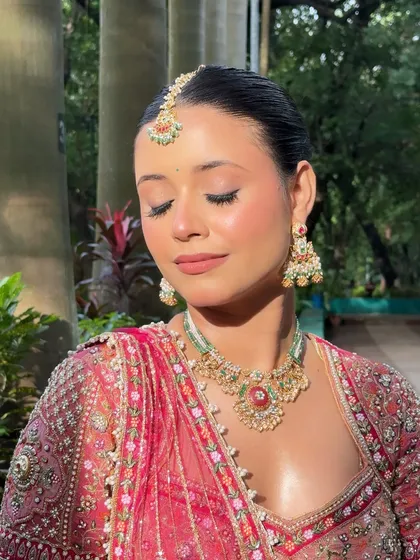 An eyes-closed shot to highlight the soft, blended eyeshadow and flawless base.