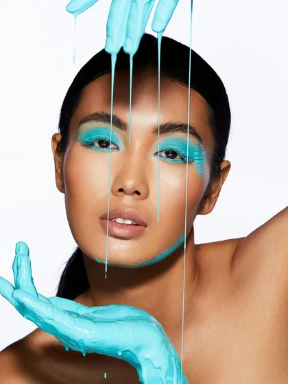 The dripping turquoise paint creates a stunning visual in this shot, showcasing the creative freedom we encourage in our students.