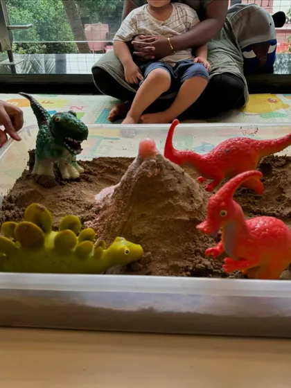 Welcome to the prehistoric world! I create detailed sensory bins like this dinosaur landscape with a volcano to spark imagination and encourage tactile learning through play.