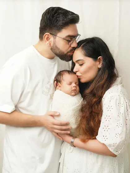 A family portrait is more than just a picture; it's the feeling of being whole. I love capturing these moments of pure connection, where mom and dad are wrapped up in the magic of their new baby. These light and airy family photos are perfect for remembering the beginning of your story.