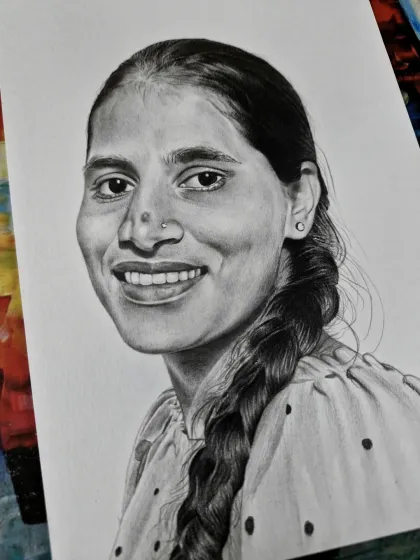 A portrait of a woman with a simple, warm smile and a traditional braid. My goal is to capture the essence of the person.