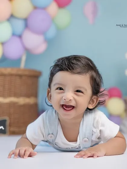 That happy grin is everything! We capture these precious expressions during milestone sessions like this six-month sitter photoshoot.
