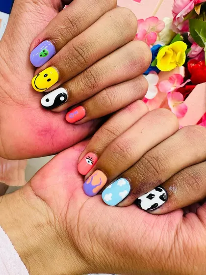 This is the kind of creative, hand-painted nail art you can learn to create. My course covers a wide range of fun and trendy designs, from characters and symbols to abstract patterns.