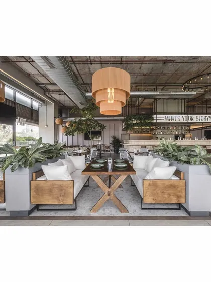 A view from a lounge seating area looking towards the main bar. This perspective shows how the different zones are visually connected, creating a cohesive and flowing space.